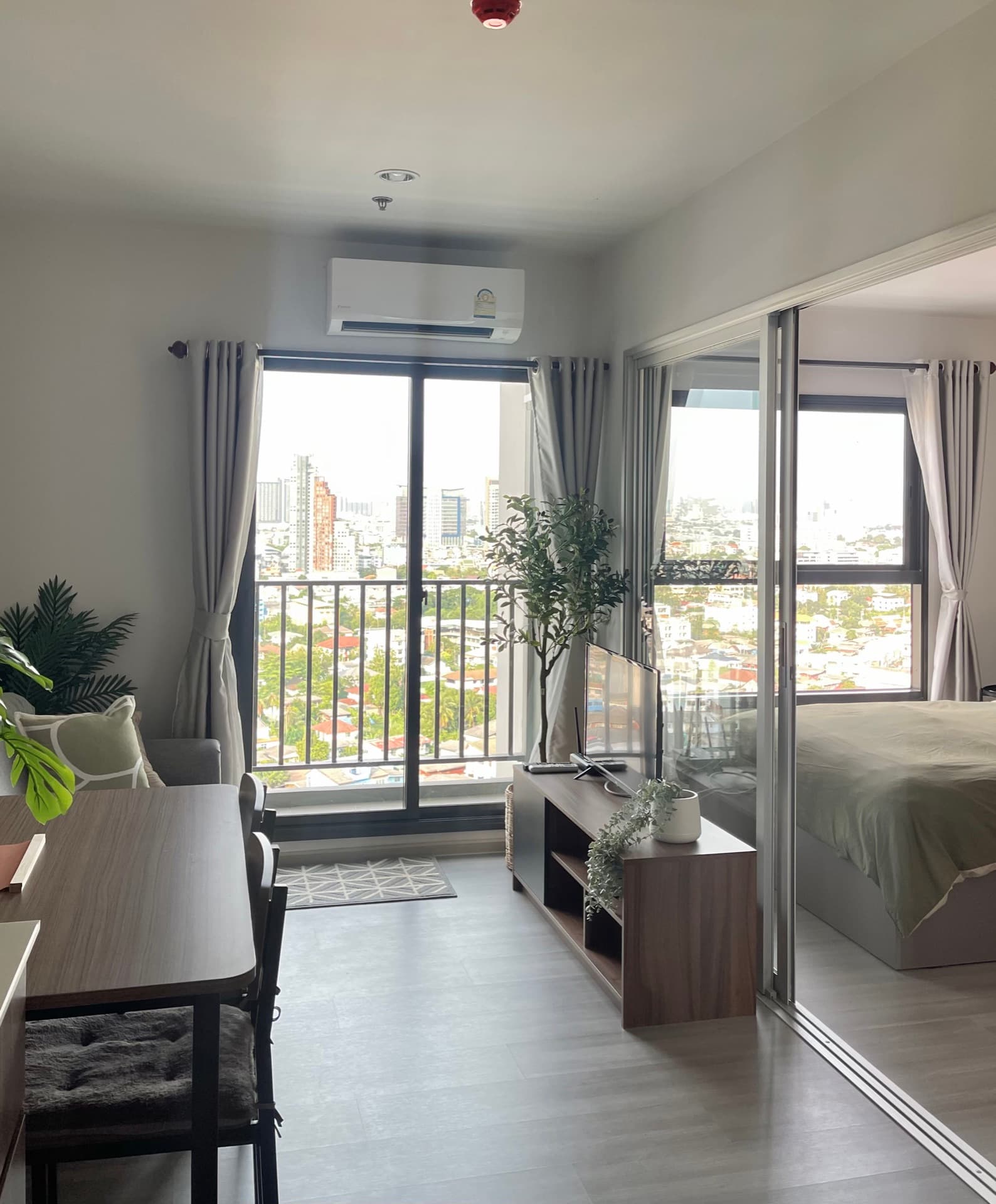Bedroom with a balcony and work desk