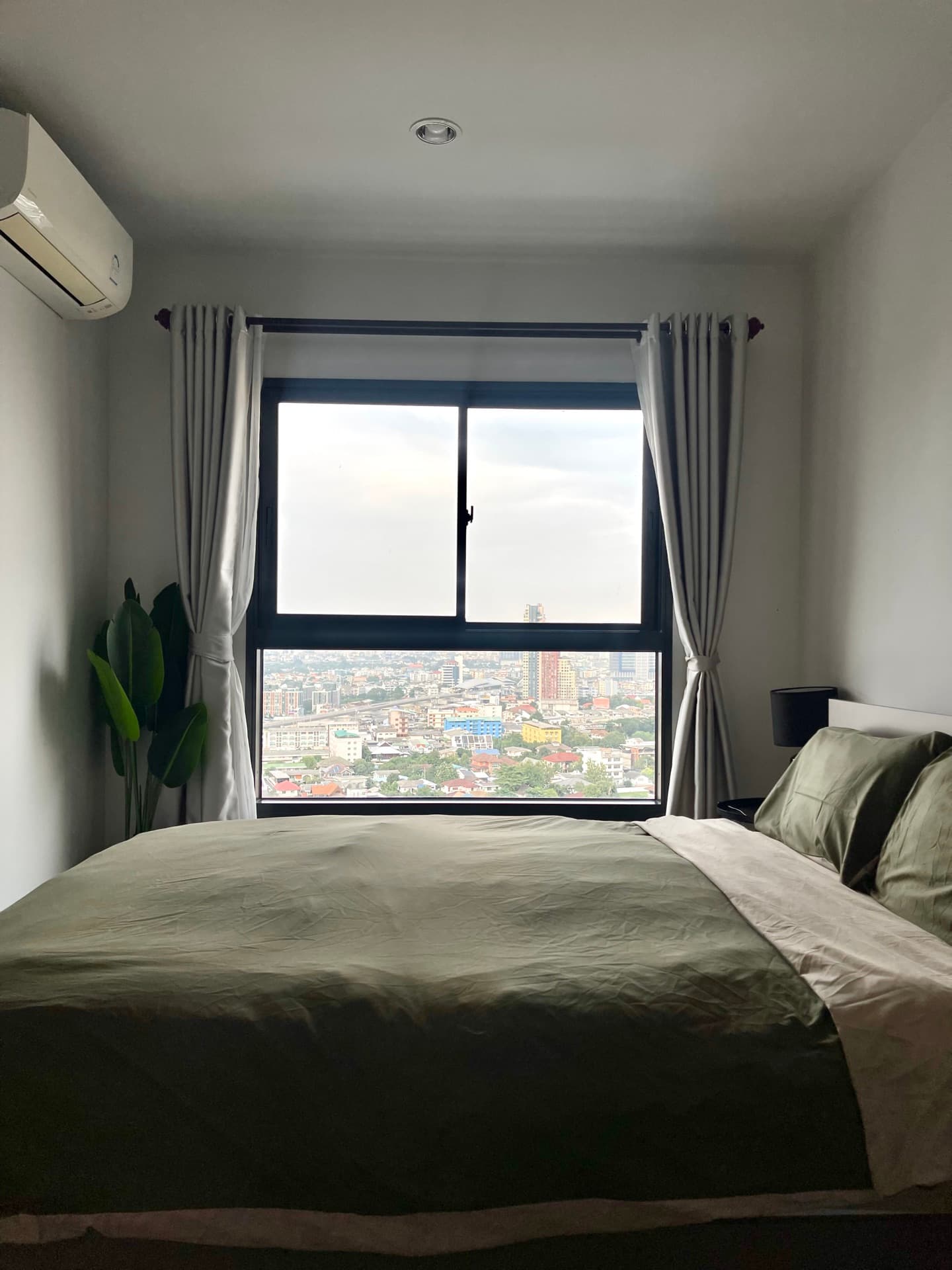 Bedroom with soft green bedding